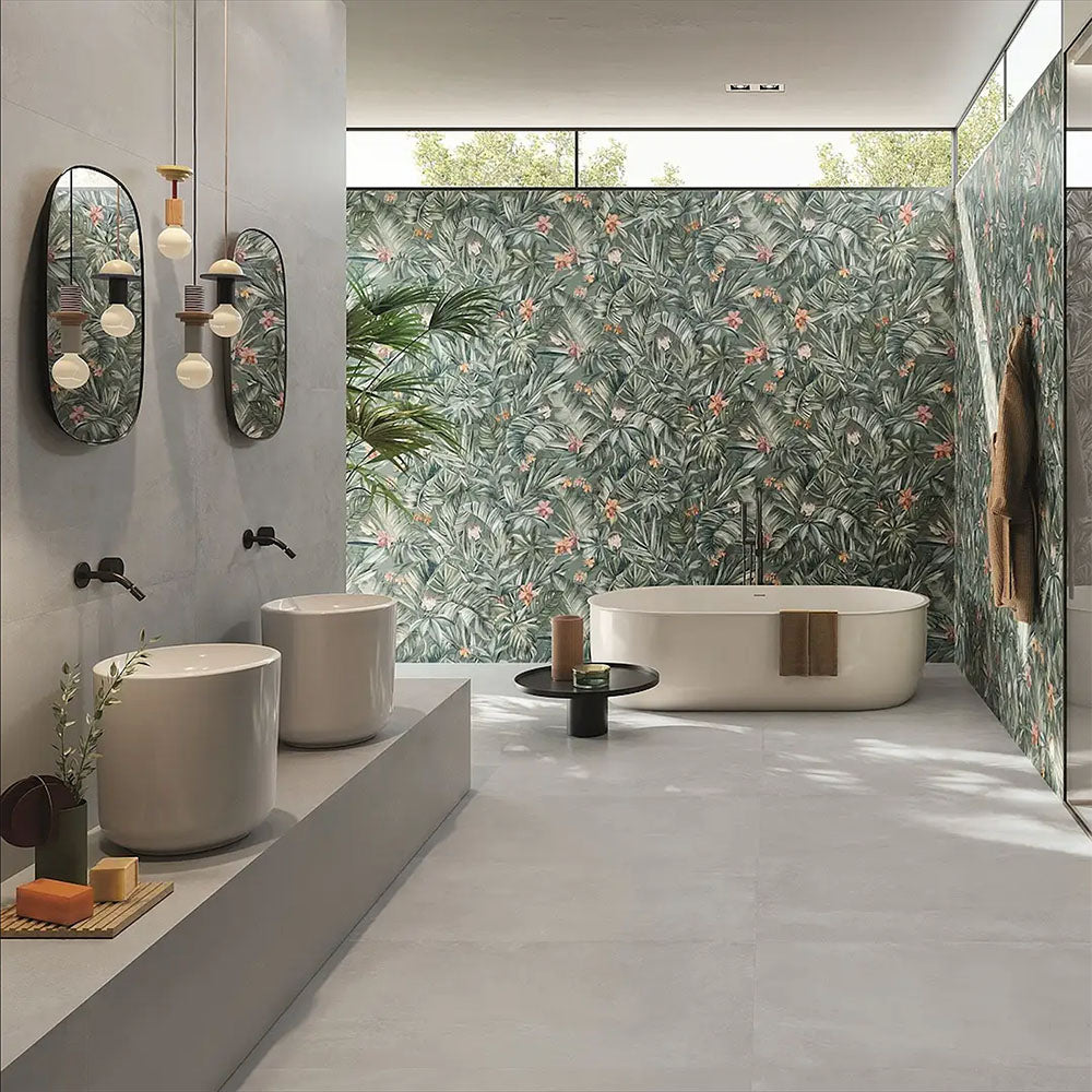 Bathroom interior featuring Etna Pearl Matt 60 × 60cm porcelain floor tiles, styled with a freestanding bath, twin basins, soft grey tones, and a statement botanical wall for a calm, contemporary finish.