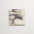 Fayrouz Calacatta Viola honed natural marble tile in a 15.2cm x 15.2cm square format, featuring a creamy white background with bold purple veining and subtle warm gold tones, creating a luxurious and timeless natural stone finish.
