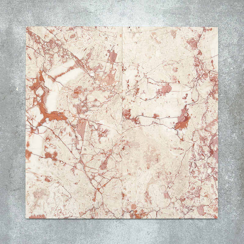 Group of two Fayrouz Sylvester Pink honed natural marble tiles in a 30.5cm x 61cm format, showcasing natural variation with soft blush pink, cream and warm terracotta veining for a luxurious, timeless natural stone finish.