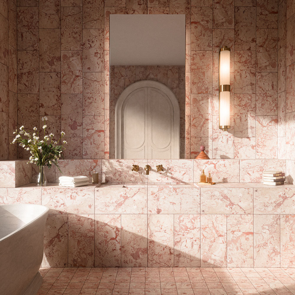 Luxury bathroom featuring Fayrouz Sylvester Pink honed natural marble mosaic floor tiles in 15.2cm x 15.2cm, paired with matching pink marble wall tiles. Soft pink natural marble with elegant veining creates a timeless, spa-inspired bathroom with warm brass fixtures.