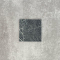 Close-up of Fayrouz Verde tumbled natural marble tiles in a 15.2cm x 15.2cm format, showcasing rich deep green tones, striking white veining and authentic stone variation with a beautifully aged tumbled finish.