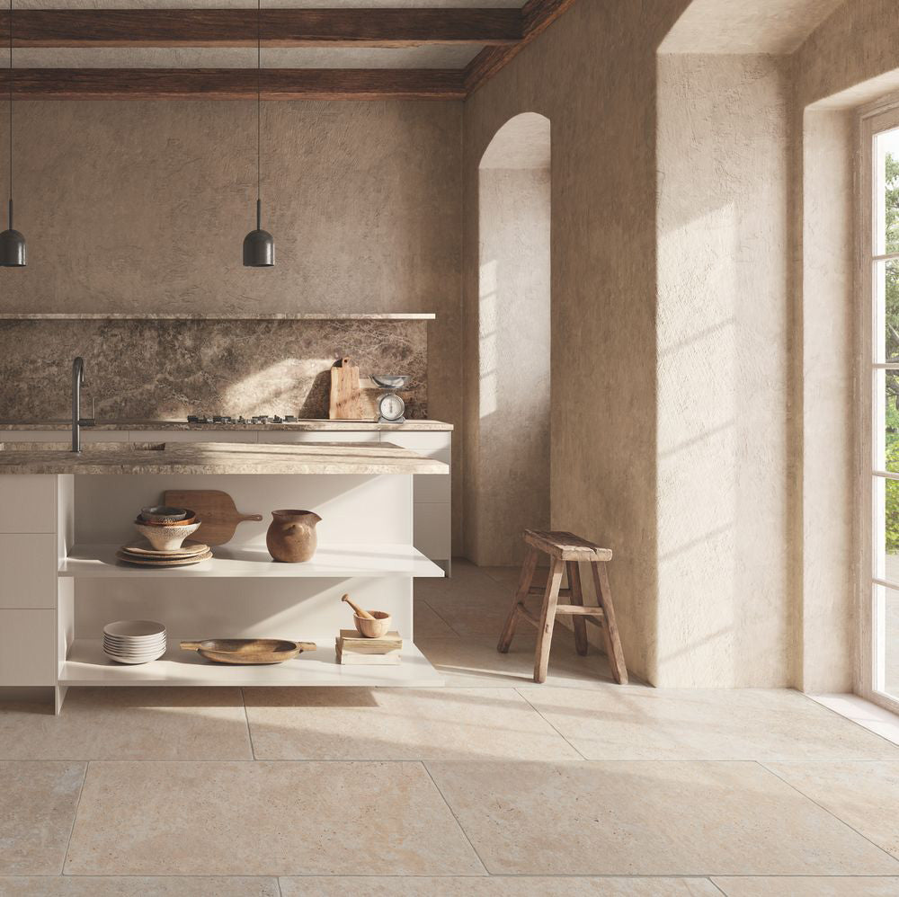 Kitchen interior featuring Flagstone Beige Tumbled Travertine 50 × 100cm porcelain floor tiles, styled with warm plaster-effect walls, rustic wood accents, and soft natural light for a relaxed, Mediterranean-inspired feel.