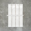 Foundry Arctic White 1.5x30cm gloss pencil bullnose border tile featuring a handcrafted-style finish with soft tonal variation, designed to complement contemporary wall tile layouts and decorative edging details.