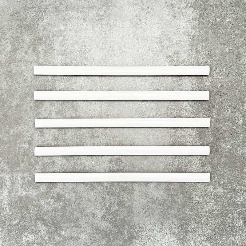 Foundry Arctic White 1.5x30cm gloss pencil bullnose border tiles with a handcrafted-style finish and soft white glaze, designed for decorative edging, borders, and finishing details in contemporary wall tile installations.
