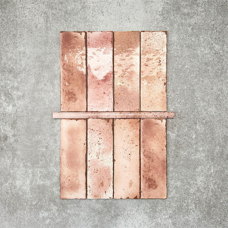 Foundry Coral Pink 1.5x30cm gloss pencil bullnose border tile featuring a handcrafted-style finish with warm blush and terracotta tones, designed for decorative edging and refined finishing details in wall tile installations.
