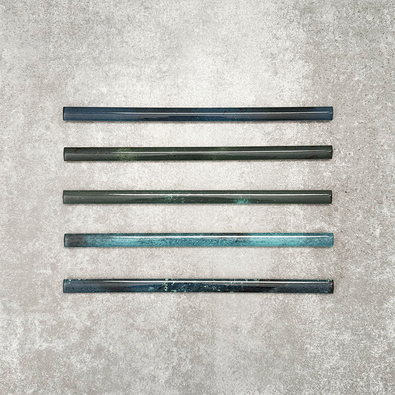 Foundry Marine Blue 1.5x30cm pencil bullnose border tile featuring a handcrafted-style finish with deep blue and teal tonal variation, designed for decorative edging and finishing details in contemporary wall tile installations.