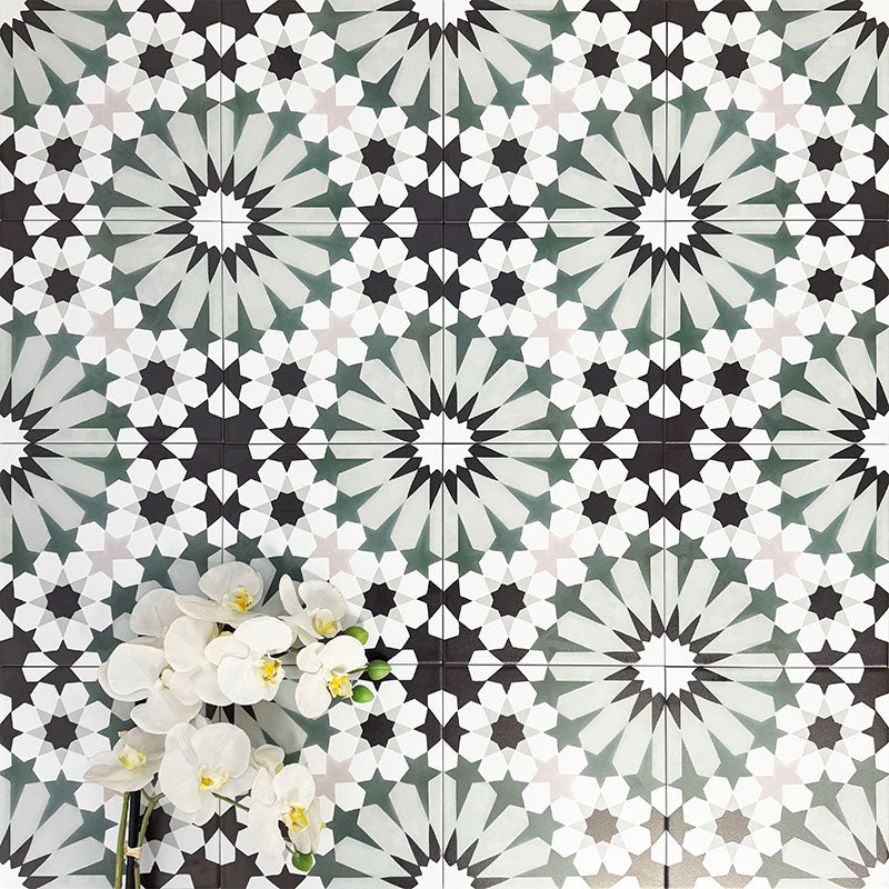 Fez Orchid Moroccan style porcelain tile with a geometric star pattern in soft green, black and white, 20cm x 20cm