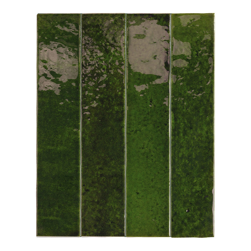 Group display of Bora Bora Tourmaline Green Brick wall tiles in 6.5x32.8cm format with a flux glaze finish, arranged vertically to highlight rich green shade variation, organic surface detailing and glossy reflective texture.