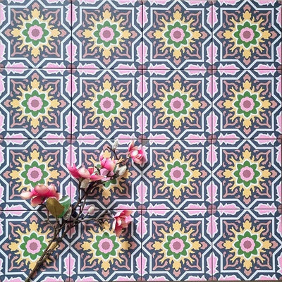 Cuba Havana Mini Moroccan-style porcelain tiles in a 15×15cm square format, arranged in a repeating geometric pattern with navy, pink, green and mustard tones, styled with floral accents to highlight the tile’s intricate encaustic-style design and decorative detail.