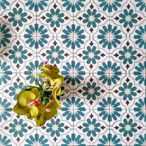 Clara Teal Victorian Moroccan-style porcelain tiles in a 20 × 20cm format, laid in a repeating pattern to showcase the teal and green geometric design across the surface.