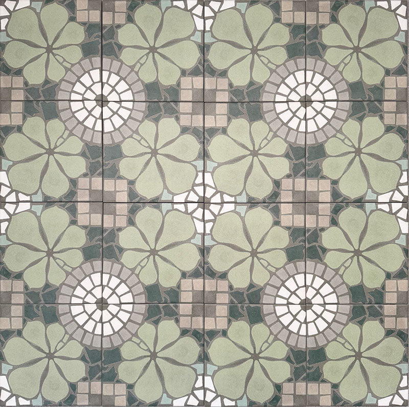 Nantes Green Moroccan-style tiles in a 20x20cm format, shown as a full repeating pattern layout. The design features soft green floral motifs combined with circular mosaic-style detailing and neutral stone-effect tones, creating a balanced, decorative floor or wall tile pattern inspired by traditional Moroccan designs.