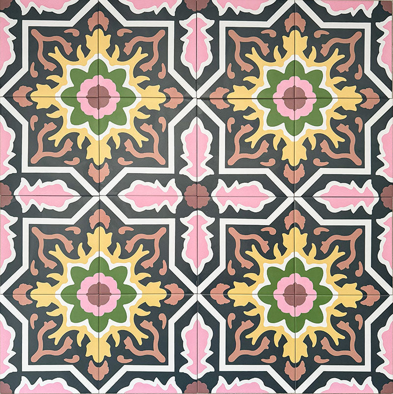 Cuba Havana Moroccan-style porcelain tiles in a 20×20cm square format, arranged in a repeating geometric pattern featuring navy backgrounds with pink, green and mustard detailing, highlighting the tile’s bold symmetry, intricate motifs and decorative encaustic-style design.