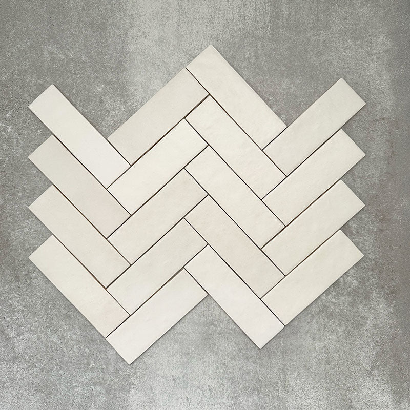 Herringbone layout featuring Zellige Chalk White Moroccan-style brick tiles in a 6.5 × 20cm format.