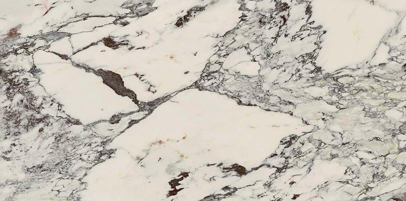 Flat lay of Hudson Capraia Matt Marble 60 × 120cm porcelain tiles, showcasing a crisp white base with bold, sweeping grey veining and deeper tonal accents, creating a dramatic marble effect ideal for statement walls and floors.