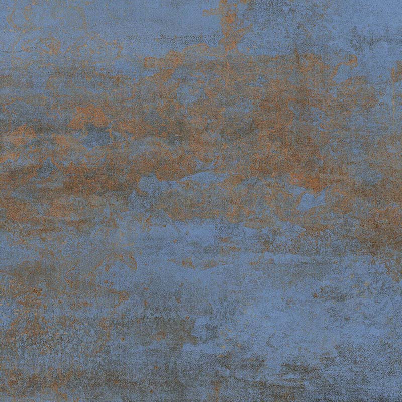 Close-up of Iron Blue Oxide Metallic 60 × 60cm porcelain tile, showcasing layered blue tones with warm rust-like oxidation, soft tonal variation, and a gently textured metallic effect for a bold, industrial-inspired finish.