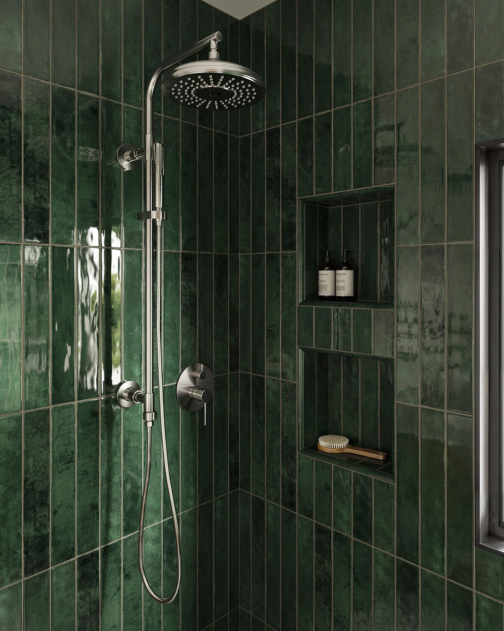 Walk-in shower featuring Jumairah Pine Forest Green 5 × 40cm gloss ceramic wall tiles, laid vertically with deep green tonal variation, paired with chrome shower fittings, recessed niches, and a clean, modern layout.