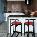 Kitchen setting featuring Viscount Park Road 20x20cm Victorian style wall and floor tiles, showcasing a repeating geometric pattern in soft grey and white tones, paired with rich brown wall tiles, dark worktops and contemporary cabinetry for a bold, design-led finish.