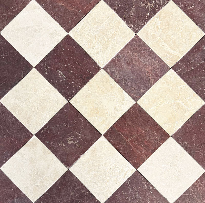 Chequerboard layout featuring Fayrouz Latte Foam 15.2x15.2cm natural marble tiles with a tumbled finish, paired with Burgundy Red marble tiles, installed diagonally to create a timeless, high-contrast floor design.