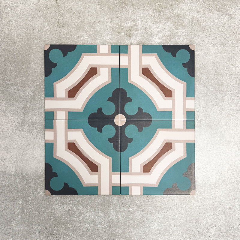 Four London Streets Leicester Square 20x20cm Victorian Moroccan style porcelain tiles arranged to display the repeating teal, cream and terracotta geometric pattern.