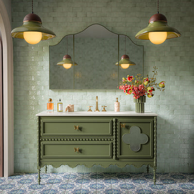Traditional bathroom featuring Liberty Mint Green Rustic Effect Gloss wall tiles in a 7.5cm x 15cm format, paired with a sage green vanity unit, brass fittings, patterned floor tiles and decorative lighting.