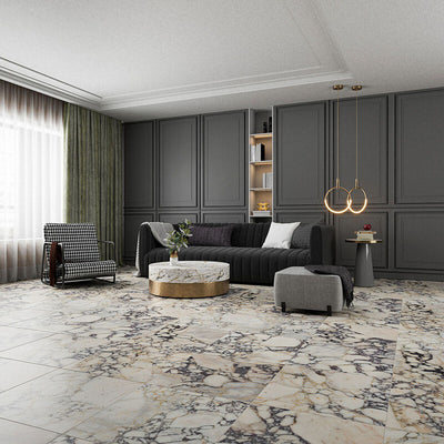 Living room interior featuring Fayrouz Picasso 30.5x61cm natural marble tiles with a honed finish, installed across the floor to showcase a white base with dramatic grey and warm gold veining, creating a bold, statement surface with rich natural variation.