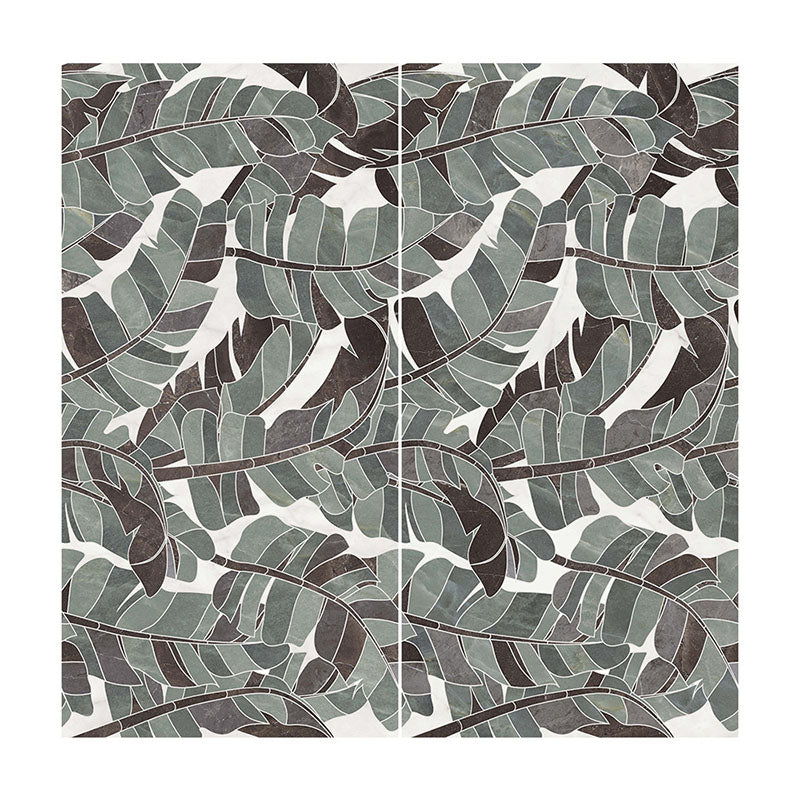 Flat lay of Lucca Bali 3D Décor 60 × 120cm porcelain wall and floor tiles, featuring layered tropical leaf patterns in soft green, grey, and charcoal tones with a bold decorative finish.