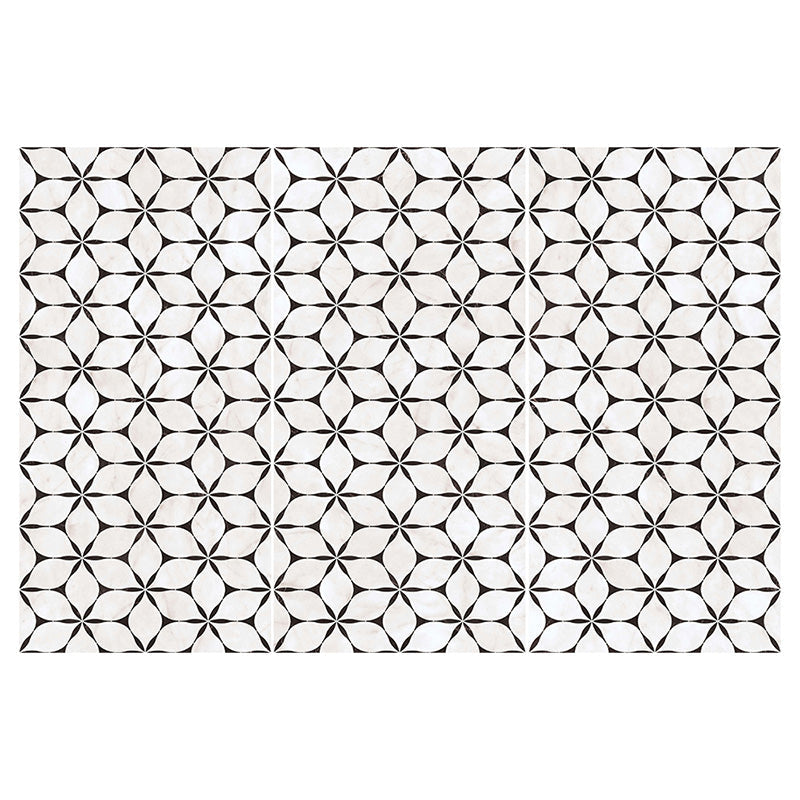 Flat lay of Lucca Flowers 3D Décor 60 × 120cm porcelain wall and floor tiles, showcasing a repeating floral geometric pattern in soft white tones with contrasting dark detailing for a bold contemporary look.