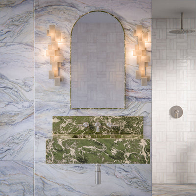 Luxury bathroom featuring Lucca Quartz Lux 3D 60 × 120cm porcelain wall and floor tiles, styled with flowing marble-effect veining, green stone vanity details, textured white wall tiles, and elegant contemporary finishes.