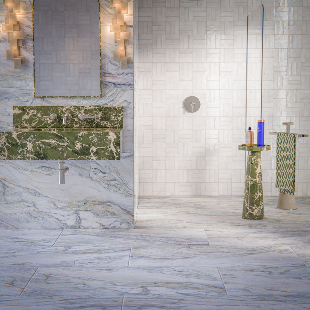 Luxury bathroom featuring Lucca Quartz Lux 3D 60 × 120cm porcelain wall and floor tiles, styled with flowing marble-effect veining, green stone vanity details, textured white wall tiles, and elegant contemporary finishes.