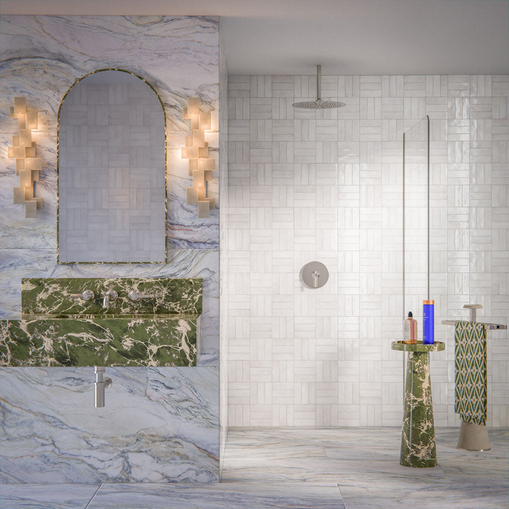 Luxury bathroom featuring Lucca Quartz Lux 3D 60 × 120cm porcelain wall and floor tiles, styled with flowing marble-effect veining, green stone vanity details, textured white wall tiles, and elegant contemporary finishes.