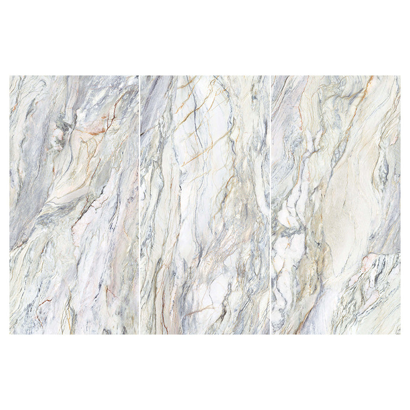 Flat lay of Lucca Quartz Matt 60 × 120cm porcelain wall and floor tiles, featuring flowing marble-effect veining in soft grey, cream, and blue tones with a sophisticated natural stone-inspired finish.