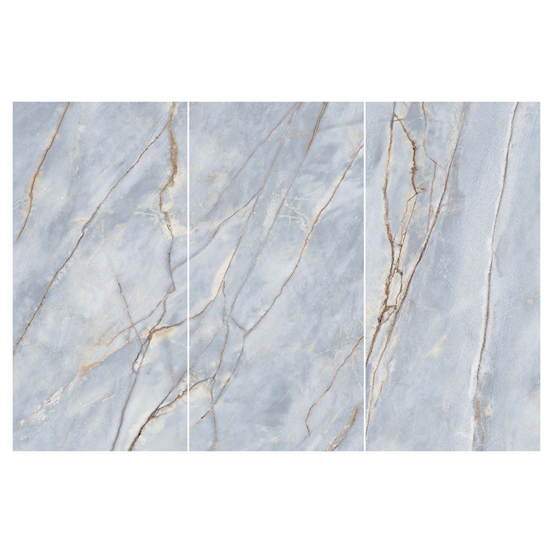 Flat lay of Lucca River Blue 60 × 120cm matt porcelain wall and floor tiles, featuring soft blue-grey marble-effect tones with delicate warm veining and a refined natural stone-inspired finish.