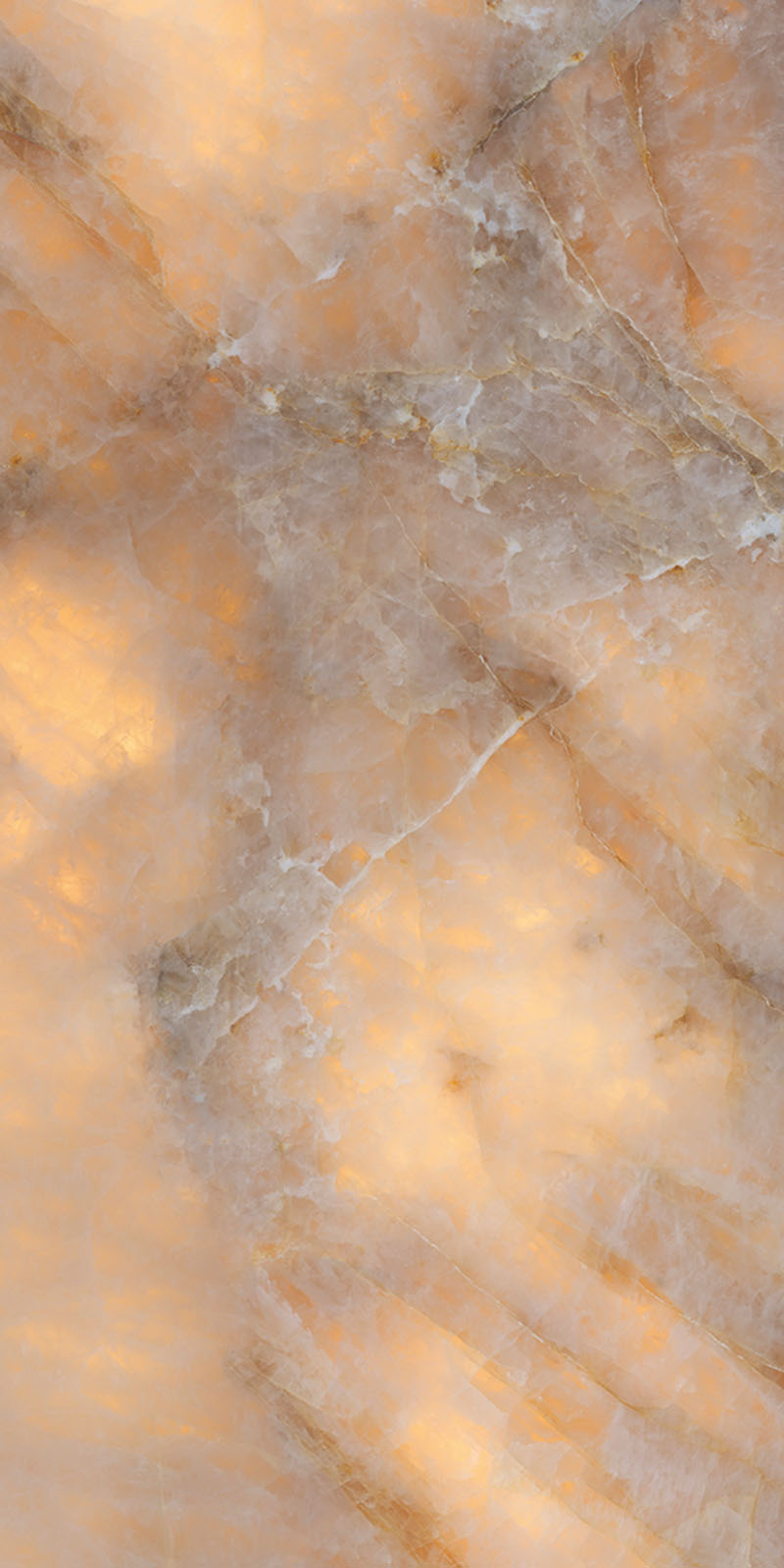 Flat lay of Lumen Precious Stone Amber 60 × 120cm polished porcelain tiles, showcasing rich amber, honey, and smoky stone-inspired tones with layered crystalline detailing, translucent mineral movement, fine natural veining, and a reflective high-gloss finish for a bold, luxurious statement surface.