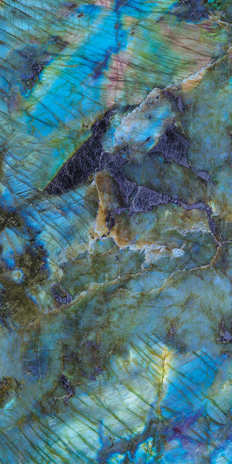 Single tile display of Lumen Precious Stone Labradorite 60 × 120cm polished porcelain tiles, featuring striking blue, teal, and charcoal gemstone-inspired tones with iridescent detailing, layered natural variation, and a luxurious high-gloss finish.