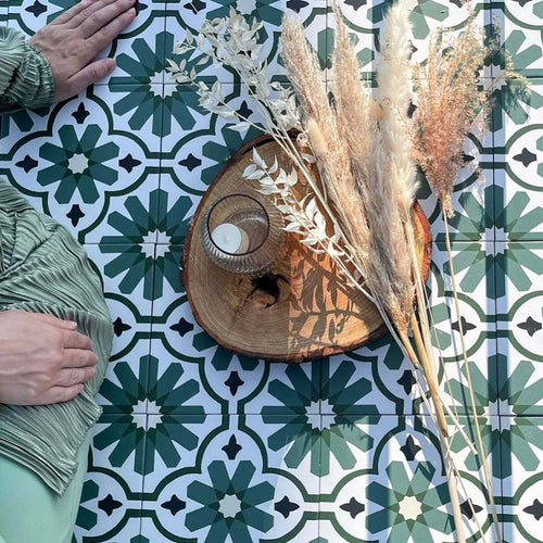 Clara Verde Victorian Moroccan-style porcelain floor tiles in a 20 × 20cm format, laid in a repeating pattern to highlight the bold green geometric design with decorative styling accents.
