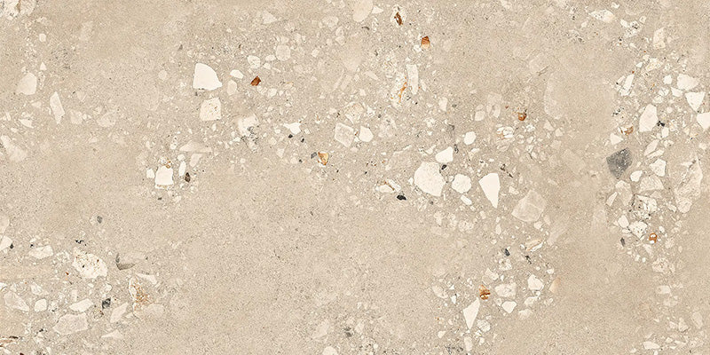 Close-up of Melange Sand Cosmo Stone wall and floor tiles 60 × 120cm, featuring warm sand-toned stone-effect detailing with terrazzo-inspired aggregate texture, subtle tonal variation, and a refined contemporary matt finish.