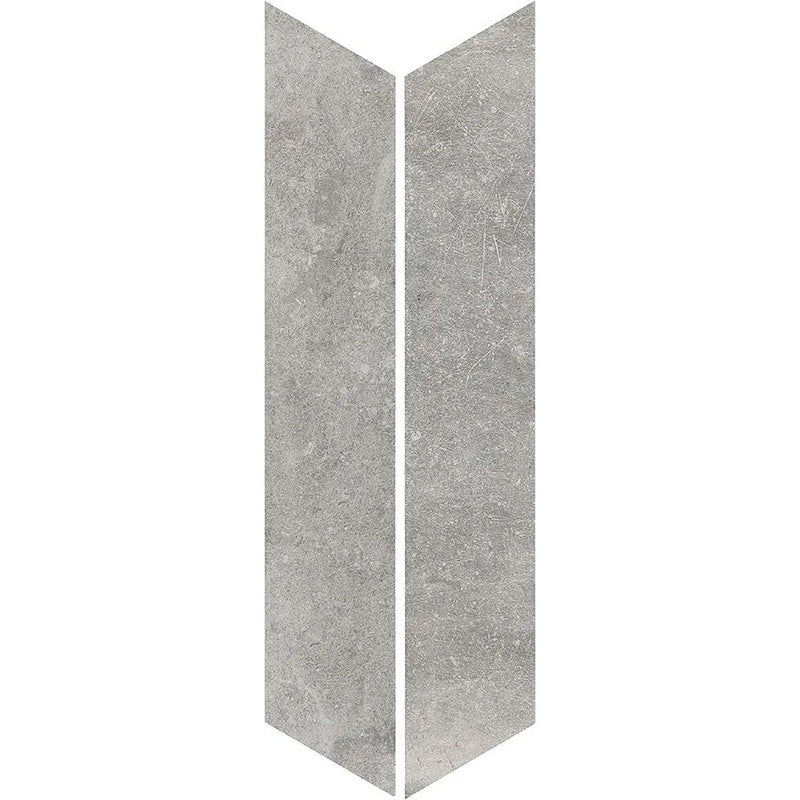 Product display of Monzo Stone Chevron Titanium 10x53cm stone-effect porcelain chevron tiles in soft grey tones, featuring subtle texture and natural tonal variation with a contemporary stone-inspired finish.
