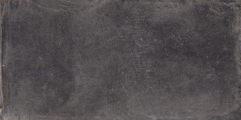 Product display of Monzo Stone Nite 30x60cm dark stone-effect porcelain tiles in deep charcoal tones, featuring subtle texture, soft tonal variation and delicate veining inspired by natural stone surfaces.