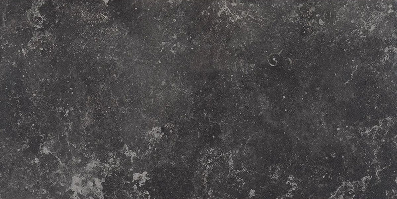 Product display of Monzo Stone Nite 30x60cm dark stone-effect porcelain tiles in deep charcoal tones, featuring subtle texture, soft tonal variation and delicate veining inspired by natural stone surfaces.