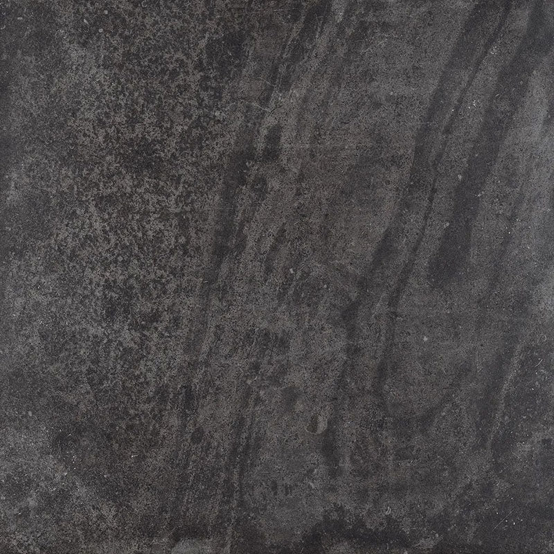 Product display of Monzo Stone Nite 60x60cm dark stone-effect porcelain tiles in deep charcoal tones, featuring dramatic tonal variation, textured detailing and natural stone-inspired movement across the surface.