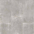 Product display of Monzo Stone Titanium 30x60cm stone-effect porcelain tiles in soft grey tones, featuring subtle texture, layered veining, and tonal variation with a natural stone-inspired finish.