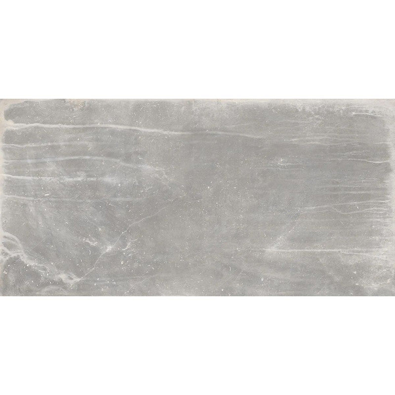 Product display of Monzo Stone Titanium 30x60cm stone-effect porcelain tiles in soft grey tones, featuring subtle texture, layered veining, and tonal variation with a natural stone-inspired finish.