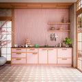 Interior featuring Nomad Rose brick-effect wall tiles, showcasing soft blush pink tones and a subtle handcrafted-inspired finish. Laid vertically across the full splashback, the tiles create height and texture while complementing the warm timber detailing and pastel cabinetry. The combination of pink hues, natural wood accents and contemporary styling creates a playful yet refined space that feels welcoming, modern and effortlessly on trend. Perfect for adding warmth, colour and personality to kitchens, bat