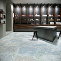 Interior featuring Boho Ocean Blue 60 × 60cm patterned floor tiles, blending soft blue and muted tones with a worn, decorative effect. Ideal for adding character to contemporary spaces such as retail interiors, kitchens, or open-plan living areas.