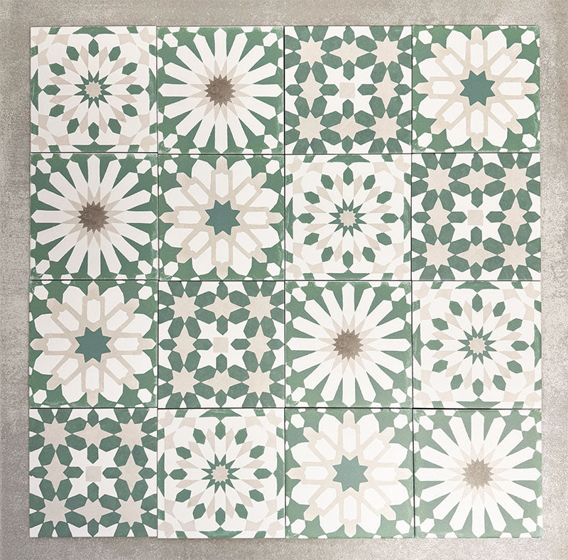 Souk Green A 20×20cm Moroccan-style porcelain patchwork tiles featuring mixed green, white and beige geometric patterns.