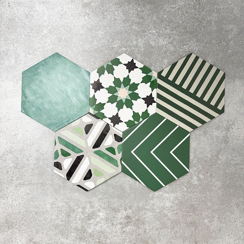 Fayrouz Verde Hexagon Patchwork Moroccan-style porcelain tiles in an 18.7 × 21.6cm hexagon format, showcasing a coordinated mix of geometric, starburst and zigzag patterns in layered green, sage, mint and charcoal tones, arranged as a decorative patchwork group to highlight colour variation and pattern diversity.