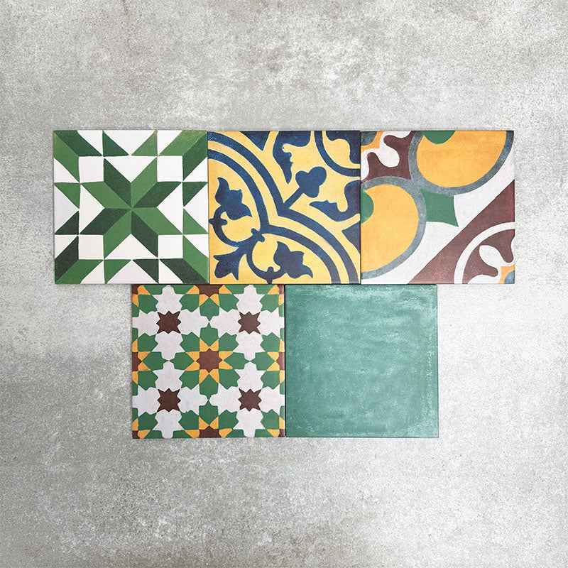Fayrouz Patchwork 20×20cm Moroccan-style porcelain tiles arranged in a colourful patchwork mix of geometric and floral patterns, featuring rich tones of blue, green, pink and warm neutrals.