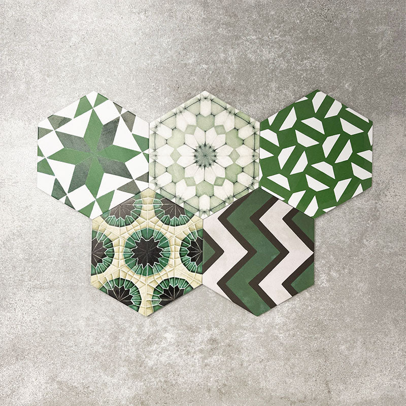 Fayrouz Verde Hexagon Patchwork Moroccan-style porcelain tiles in an 18.7 × 21.6cm hexagon format, showcasing a coordinated mix of geometric, starburst and zigzag patterns in layered green, sage, mint and charcoal tones, arranged as a decorative patchwork group to highlight colour variation and pattern diversity.