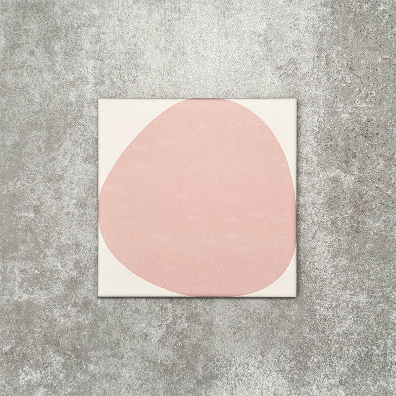 Pebbles Reversed Pink 20x20cm porcelain Moroccan-style tiles featuring soft blush abstract shapes on a warm white background, designed to create playful statement walls and contemporary patterned interiors.