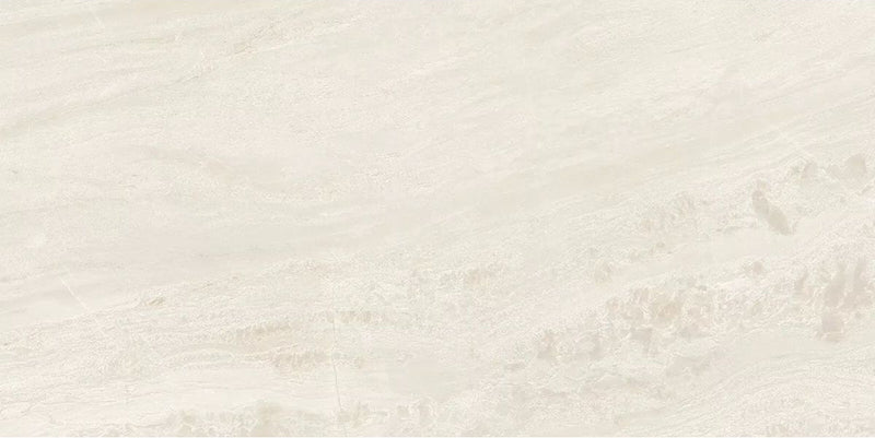 Close-up of Petra Beige stone marble effect porcelain wall and floor tiles in a 30cm x 60cm format, showcasing warm beige, ivory and soft cream veining with subtle natural stone-inspired movement, creating a timeless and elegant surface for bathrooms, kitchens, living spaces and commercial interiors.